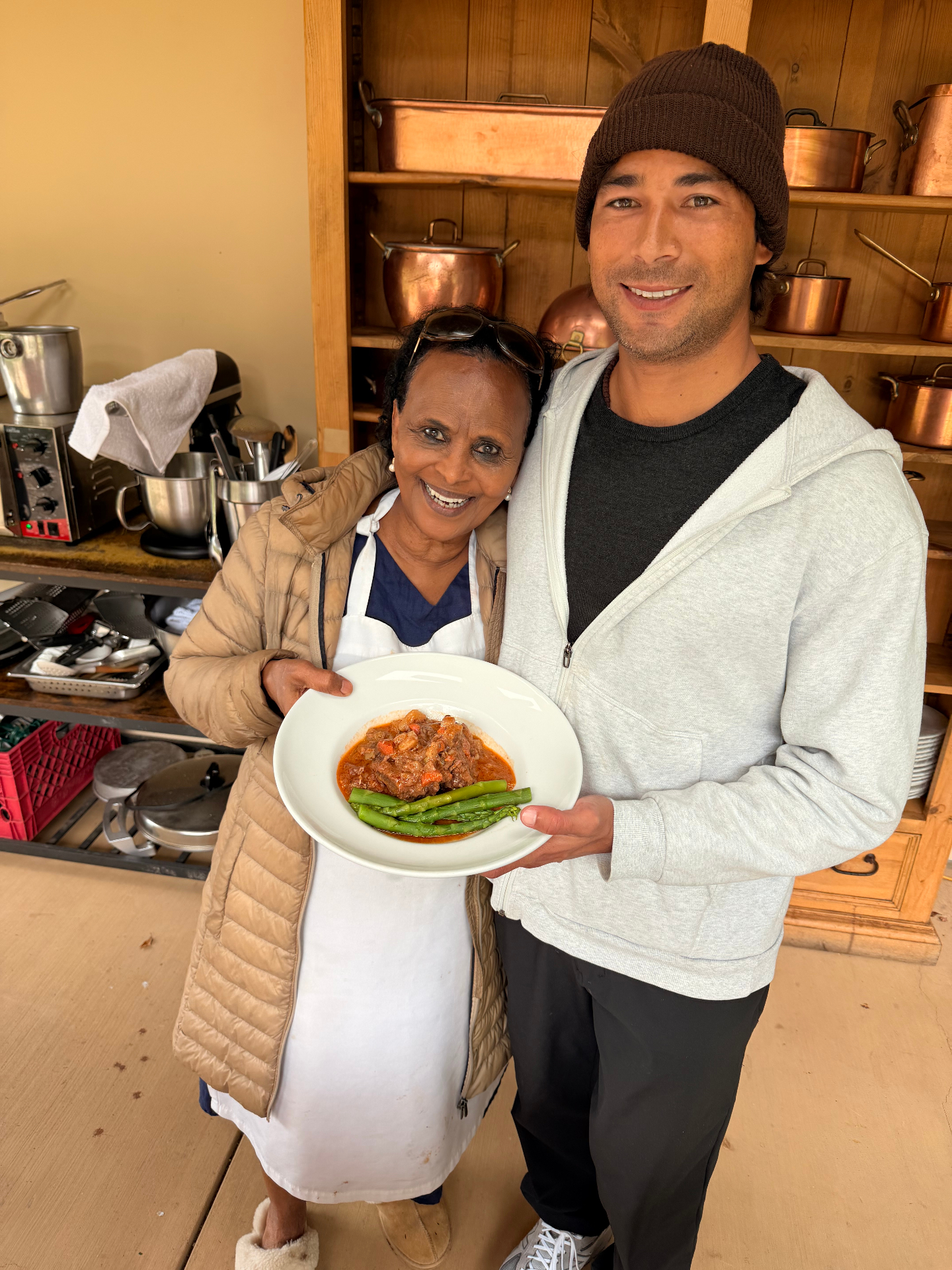 Chef Mollie and guest presenting a finished dish